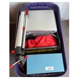 Purple Plastic Storage Bin with Tools, Saw, and Ac