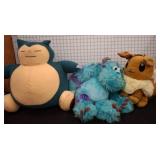 Three Plush Toys, Including Snorlax, Eevee