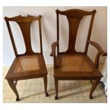 Two Wood Chairs With Caned Seats
