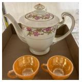 Floral Teapot and Two Orange Glass Cups