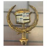 Gold-Tone Automotive Emblem with Crest Design