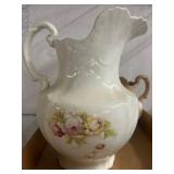 Two Floral Porcelain Decorative Pitchers