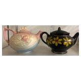 Two Ceramic Teapots with Floral Motifs