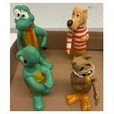 Four Plastic Cartoon Character Figures