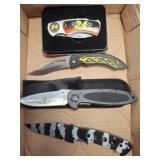 4 Folding Knives with Themes and Tin Case
