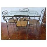 Glass-Top Table With Four Metal Chairs