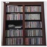 Wood Media Cabinet With Assorted CDs