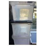 Three Plastic Storage Bins with Lids
