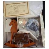 Porcelain Tex Doll on Rocking Horse