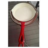 Two Red Enamel Cast Iron Skillets
