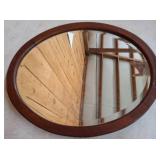 Oval Wood-Framed Mirror with Visible Crack