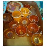 Carnival Glass Teacups, Saucers, and Creamer Set