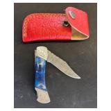 Folding Knife with Blue Handle and Red Sheath