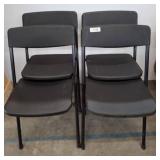 Four Black Folding Chairs