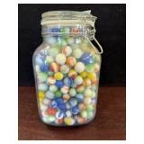 Glass Jar Filled With Assorted Marbles