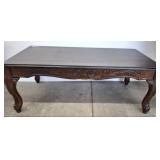 Carved Wood Coffee Table with Decorative Scrollwor