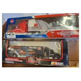 Two Die-Cast Racing Team Transporter Models