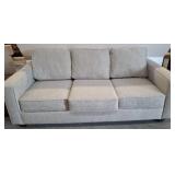 Three-Cushion Gray Upholstered Sofa