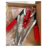Red and Silver Bottle Capper Tool