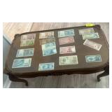 Glass-Top Table With Assorted Paper Currency Displ