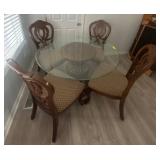 Glass-Top Dining Table with Carved Base and Chairs