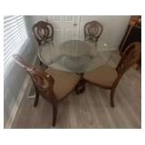 Glass-Top Dining Table with Carved Base and Chairs