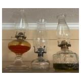 Three Clear and Embellished Glass Oil Lamps