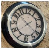Sharp Wall Clock With Black Trim and White Face