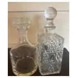 Two Glass Decanters with Stoppered Lids