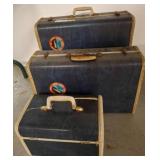 Three Vintage Blue Suitcases
