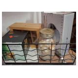 Wire Basket With Kitchen Tools and Decorative Jar