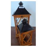 Two Wooden Lanterns with Black Metal Tops