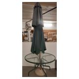 Glass-Top Patio Table with Green Umbrella