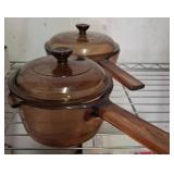 Two Amber Glass Sauce Pans with Lids