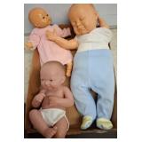 Three Vinyl Baby Dolls in Various Attire