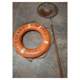 Orange Lifebuoy and Fishing Net on Wooden Pole