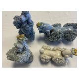 Four Ceramic Poodle Figurines