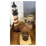 Decorative Lighthouse, Sun Motif Ornament, and Mug