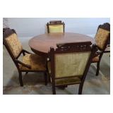 Round Table with Four Upholstered Chairs