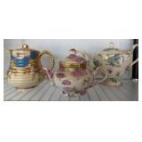 Three Ceramic Teapots with Gold Accents, Various D
