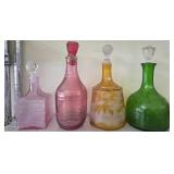 Four Glass Decanters with Stoppers