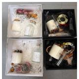 Four Gift Boxes with Candles and Botanicals