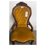 Carved Wood Chair With Tufted Yellow Upholstery