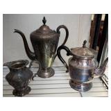 Three Silver-Plated Teapots and Creamer
