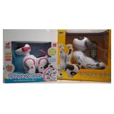 Two Toy Robot Dogs in Original Packaging