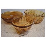 Three Amber Glass Bowls
