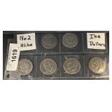 6 Eisenhower Dollar Coins in Sleeves