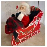 Santa Figurine in Decorative Red Sleigh