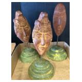 Three Terracotta Style Mask Sculptures on Stands