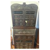 Carved Wood Cabinet with Star and Wing Motifs